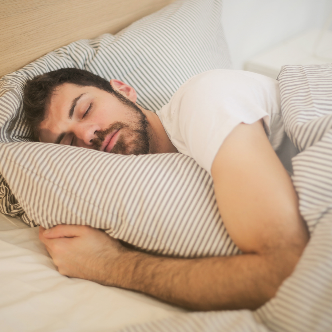 Man falling asleep easily after practicing good sleep hygiene