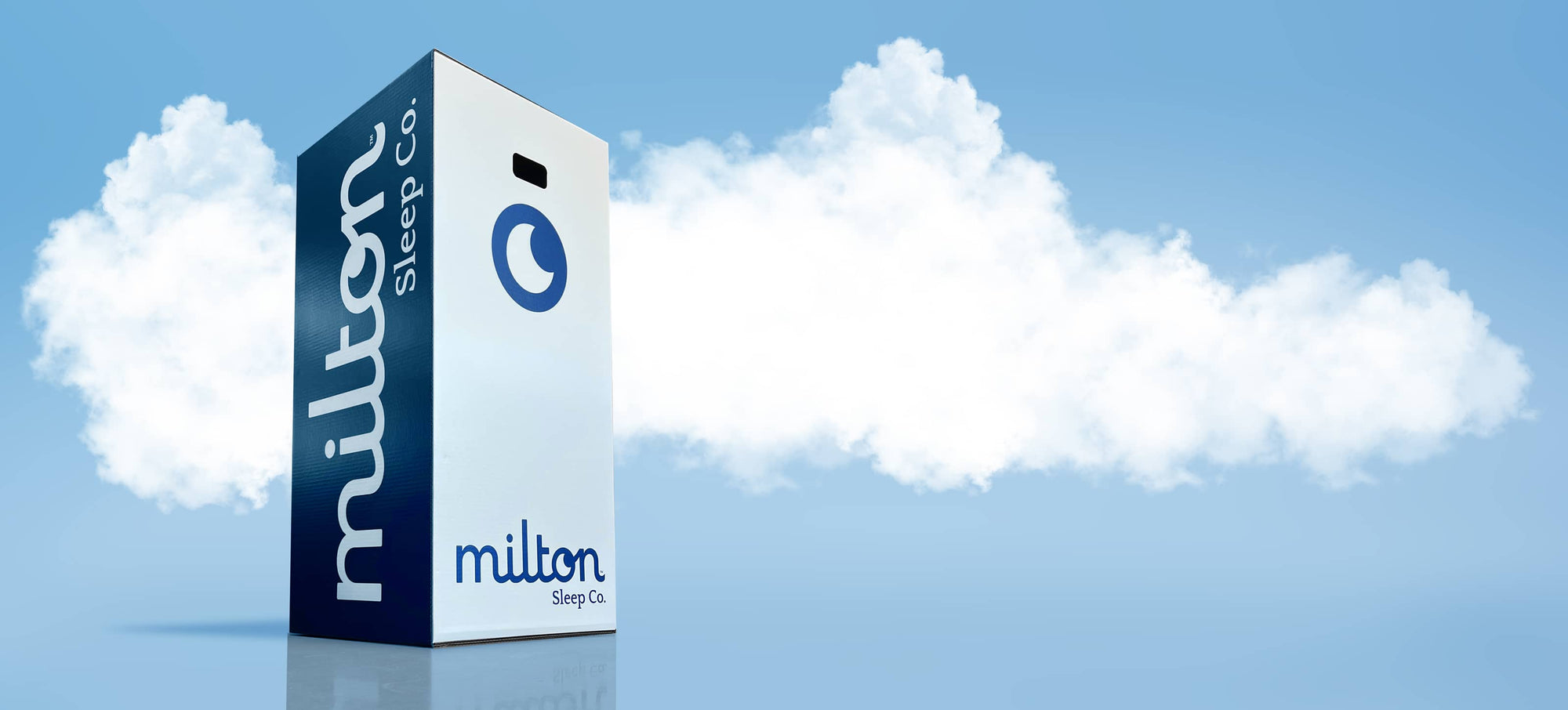 Milton Sleep Co. Box in front of puffy cloud background